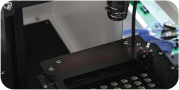 Substrate entering dim test module in LED tester machine for brightness and electrical testing