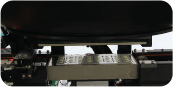 Substrate lifted into integrating sphere for optical testing in automated LED tester system