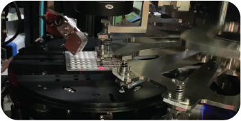 Tray pulled from magazine and picked up for automated optical inspection system