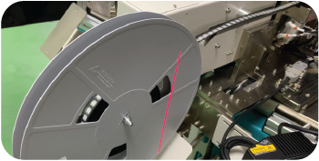 Optional tape and reel output system integrated with automated optical inspection system