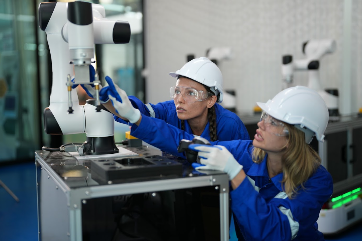 2 workers examine a related deep learning vision system