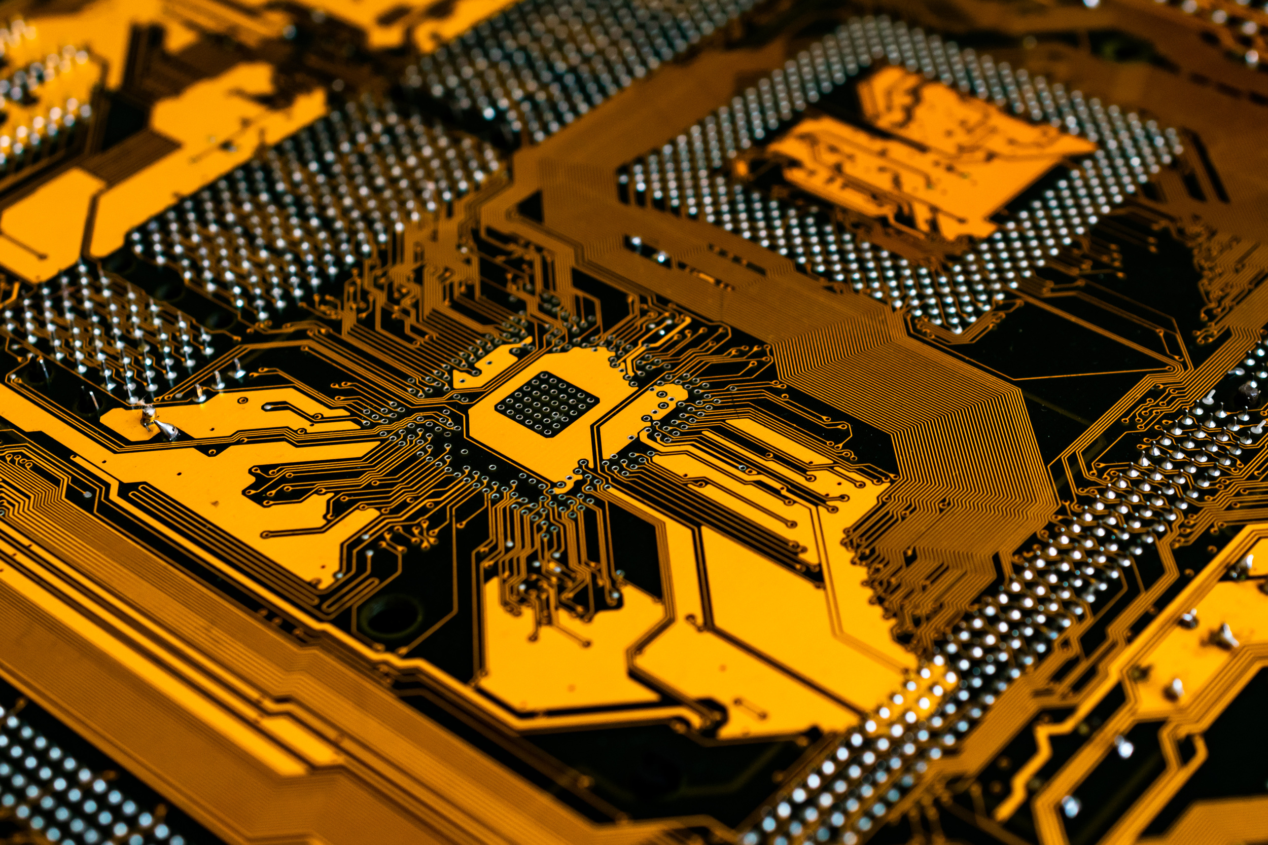 A clean gold electronic circuit after wire bond inspection